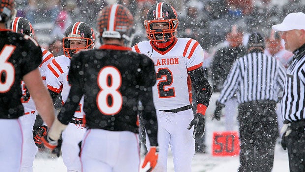 In Pennsylvania, Port Allegany and Clarion Area team captains meet before the game. The snow certainly didn't let up during the game.