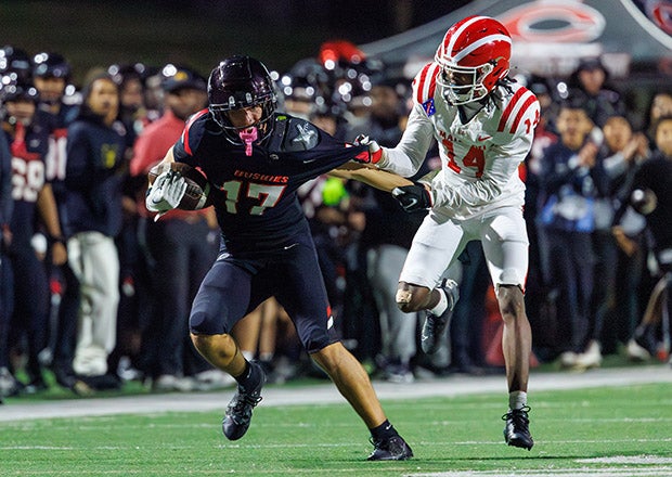 Gavin Lorge (17) of Centennial tries to escape from Jaylen Grier of Mater Dei during the first half of Friday's Southern Section Division I semifinal. (PHOTO: Scott Padgett)