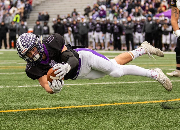Rolling Meadows  (IL) receiver Jordan Wiles makes a diving catch for a touchdown against Lincoln during first-round 7A IHSA playoff game.  