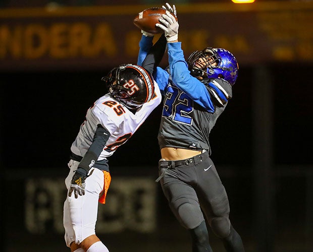 Brayden English of Rivercrest (Texas) outleaps Tom Bean receiver Alex Sanchez for an interception during a UIL 2A Division 1 Region II Bi-District playoff game.