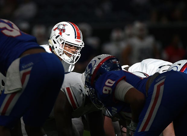 Atascocita (Texas) quarterback Brice Matthews is lit by the sunlight shining through the high windows of NRG Stadium during a UIL 6A Division 1 Region III Area playoff game against Dickinson.  
