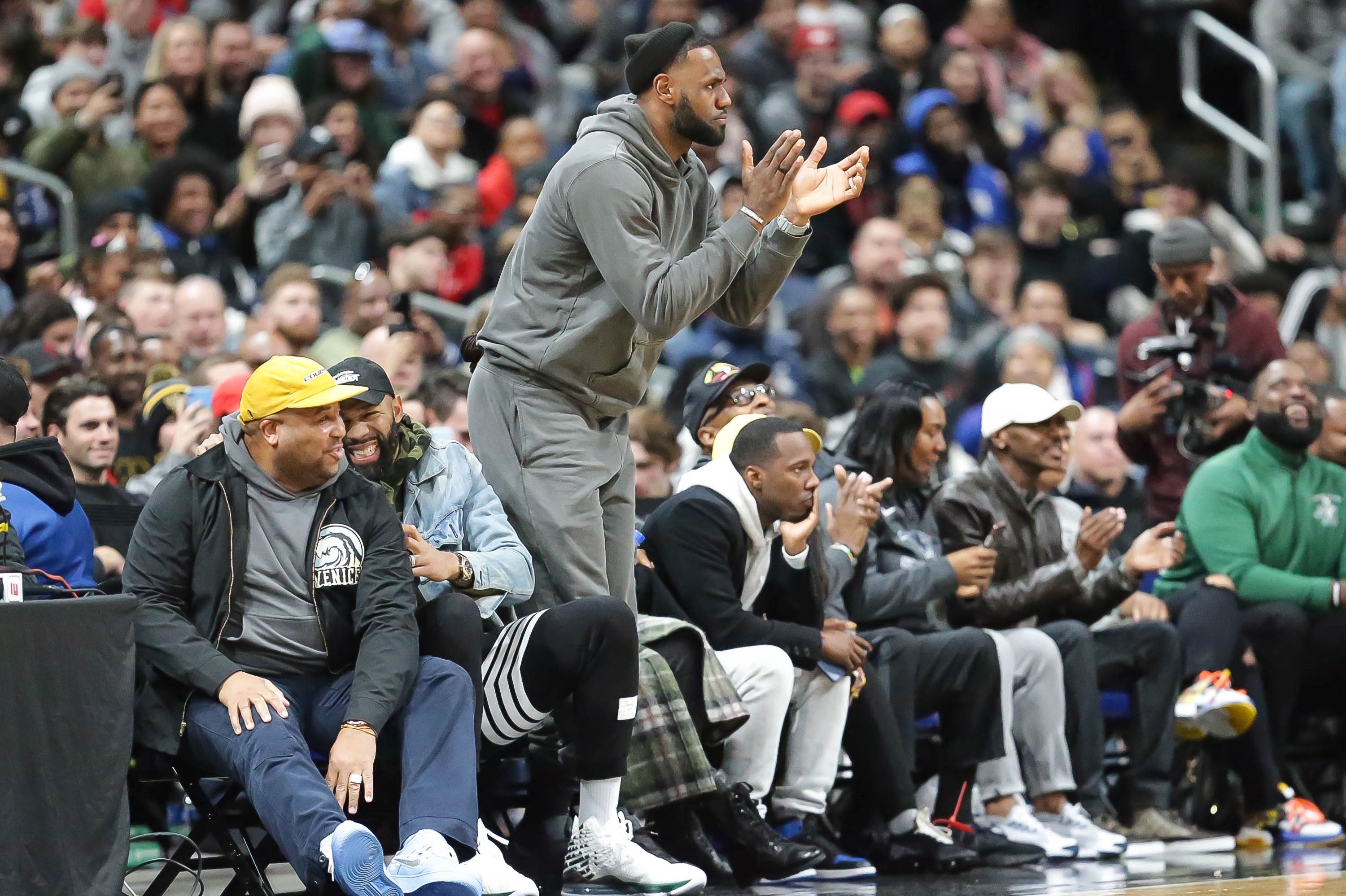 LeBron James, our retroactive 2003 Male High School Athlete of the Year, cheers on his son at a game in December.