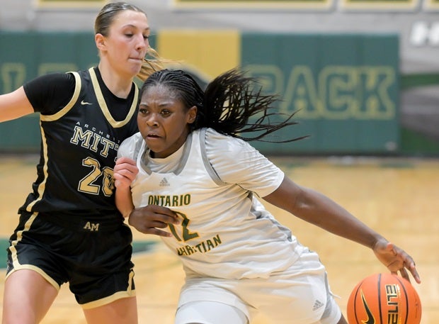 Ontario Christian's Tatianna Griffin drives against Mitty's McKenna Woliczko on Saturday. Griffin finished with a team-high 12 points for the Knights. (Photo: Darin Sicurello)