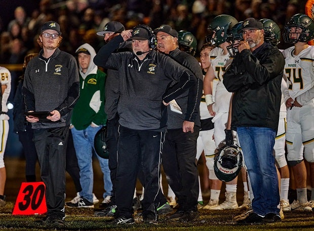Paradise coach Rick Prinz, center, announced his retirement Thursday after 22 seasons leading the Bobcats.
