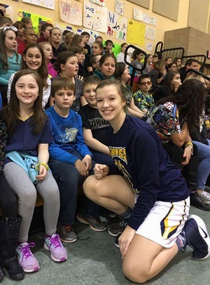 Ost enjoys giving her time to young children at
school and in the community.