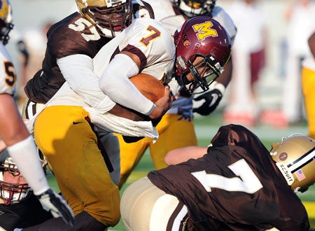Milan Collins carries for Bishop McNamara.
