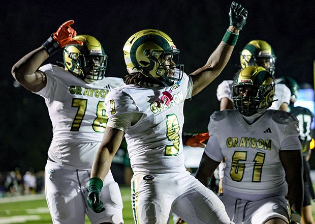 Jordan Agbanoma (78), Josh Thomas (9) and Aiden Williams (61) celebrate a touchdown in Grayson's season opener. The Rams have outscored their last nine opponents 418-58. (PHOTO: Brandon Sumrall)