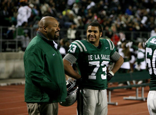 Larry Allen III talks with his father, Larry Allen Jr.