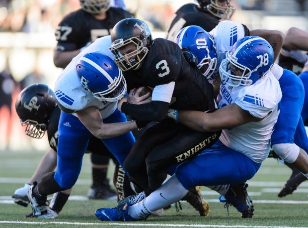 Jay Tufele pulls down a Lone Peak ballcarrier during the 2015 Utah Class 5A state championship game.