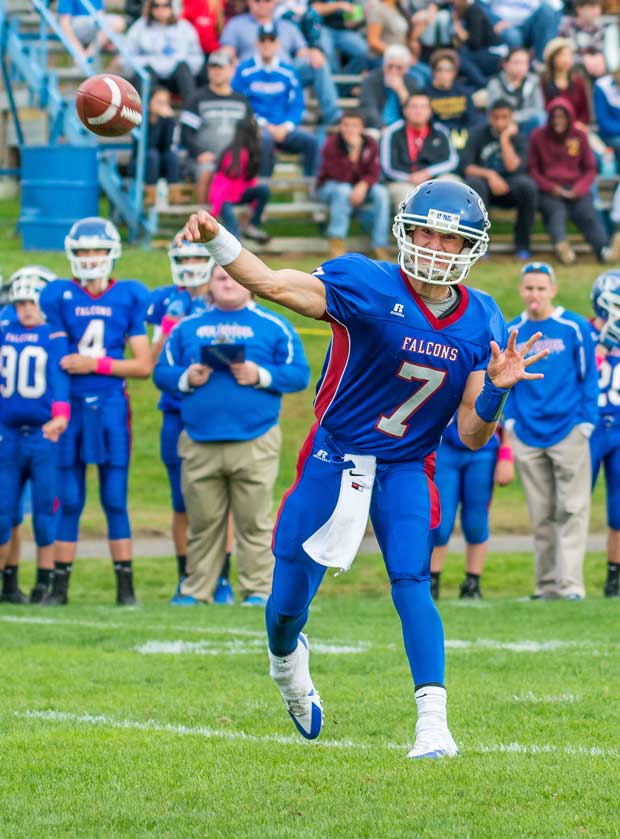 A St. Paul Catholic (Bristol, Conn.) quarterback lets loose with a pass.