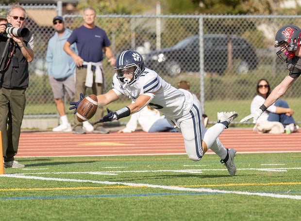Marin Catholic's Peter Macaulay lays out for a pass in the second quarter of the Wildcats' 42-7 win over Redwood. (Photo: Charles Chang)