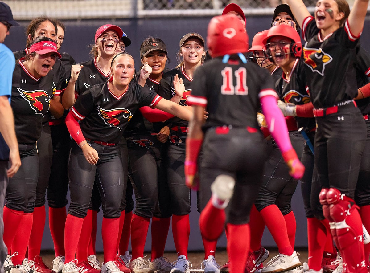 No. 1 Melissa (TX) cheers for Amariee Bradford as she runs to home plate after smacking an April 17 home run. The Cardinals are the national high school softball record holders with 106 home runs in one season. (PHOTO: Michael Horbovetz)