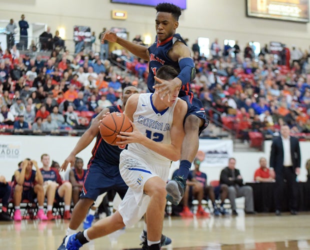 Findlay Prep's Oshae Brissett leaps while face-guarding Bishop Gorman's Zach Collins during the Big City Showdown in Nevada.