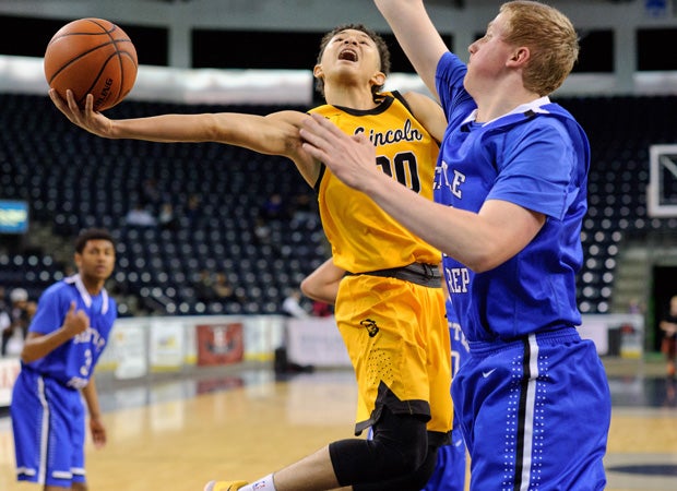 Lincoln (Wash.) guard Trevante Anderson drives to the basket while guarded by Seattle Prep's Collin Welp.  