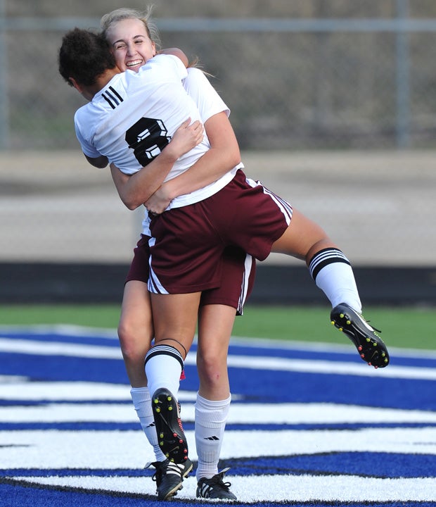 Taty Elsea (8) of Liberty (Calif.) celebrates with a teammate after scoring a goal against Plano in the National Elite Prep Showcase in Texas.