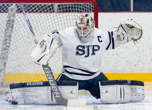 St. John's Prep (Mass.) goalie Kyle Martin makes a toe save on a shot by an Xaverian Brothers player.