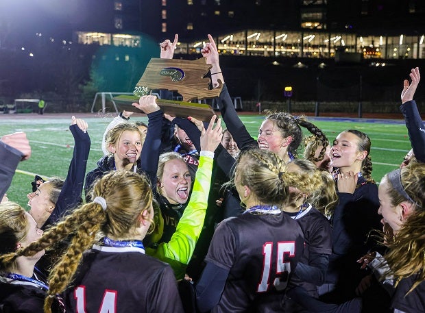 Wellesley players celebrate their Massachusetts Division 1 title after beating Bishop Feehan. (Photo: Brian Kelly)