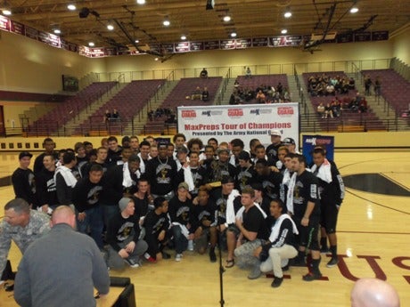 The Hamilton High players celebrate on the night they earned the Minuteman Trophy.