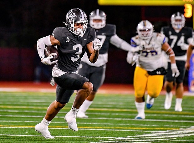 Bosco wide receiver DeAndre Moore looks for more yards after a catch from Pierce Clarkson in the CIF Open Division finals at Saddleback College on Saturday. (Photo: Louis Lopez)