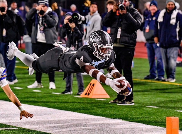 St. John Bosco defensive back Aaron Williams dives for the pylon on his 31-yard pick-6 in the first half of the Braves' rout of Serra on Saturday in the CIF Open Division finals at Saddleback College. (Photo: Louis Lopez)