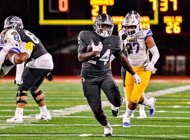 Khalil Warren looks to bully his way into the end zone for St. John Bosco in its CIF Open DIvision finals win Saturday over Serra. (Photo: Louis Lopez)