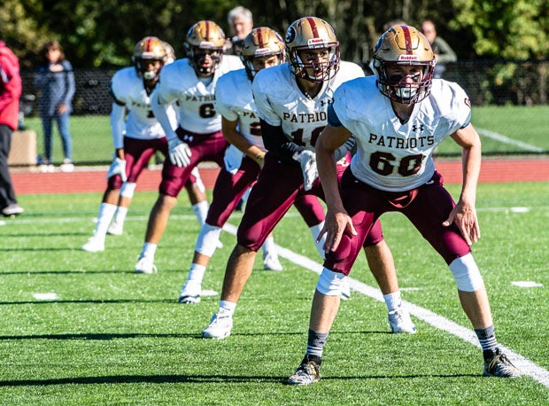 The Concord-Carlisle Patriots line up for the opening kickoff of a 2019 game with Wayland.