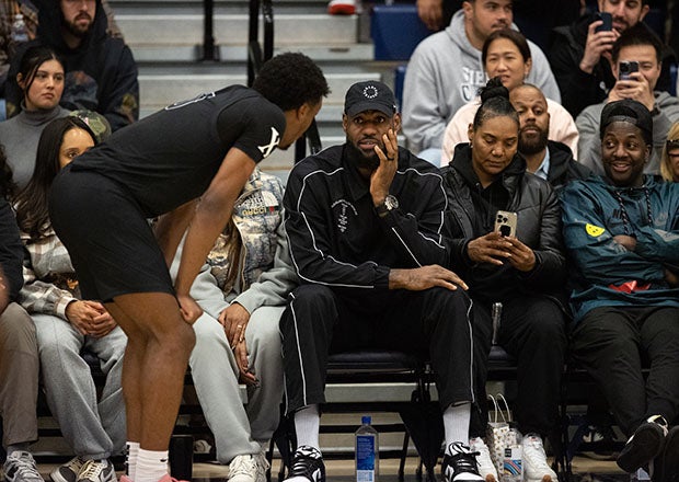 The star-studded crowd at Sierra Canyon included the King himself, LeBron James, shown here chatting with Bronny during a break in the action. (Photo: Michael Coons)
