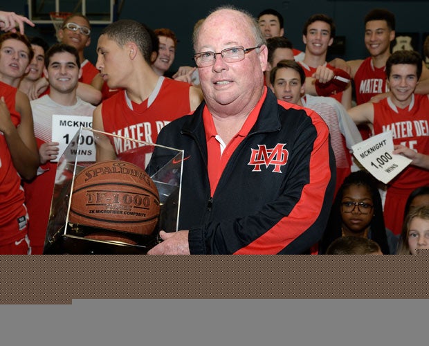 Gary McKnight proudly holds the game ball Friday night after notching the 1,000th win of his illustrious head coaching career at Mater Dei.