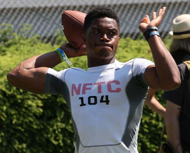 Quarterback Jerrod Heard, of Guyer (Denton, Texas), drops back to pass during Monday's training camp.