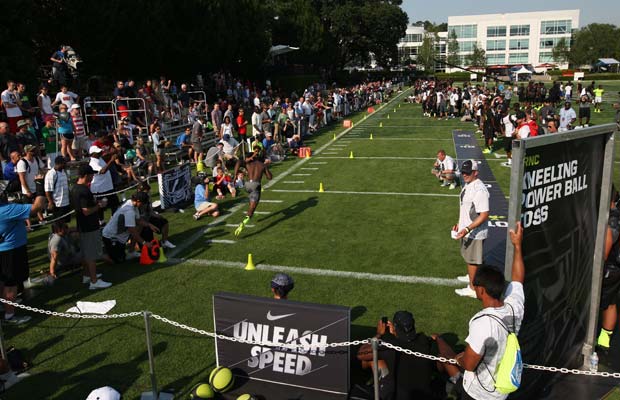 Fans and players look on as an athlete runs the 40-yard dash during the SPARQ Rating National Championships on Monday at Nike World Headquarters in Beaverton, Ore.