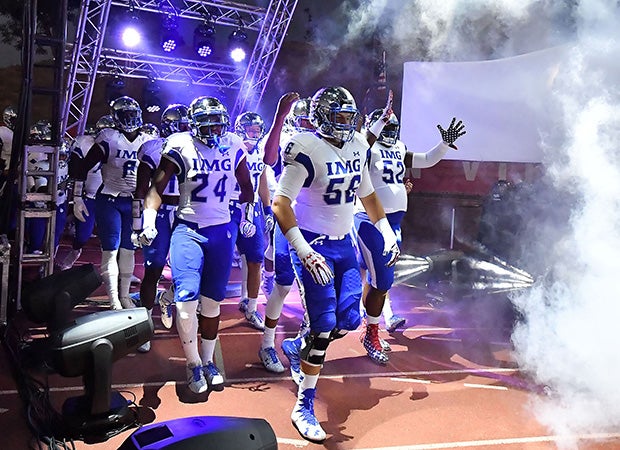 IMG Acadmey players take the field before their showdown with Centennial on Saturday night in the Honor Bowl in Mission Viejo (Calif.).