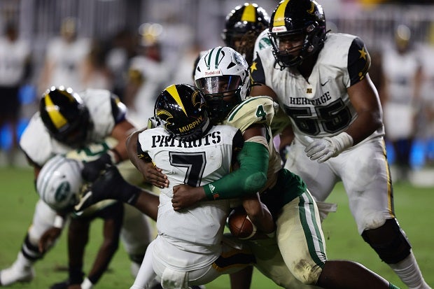 Miami Central defensive end Rueben Bain swallows up American Heritage quarterback Blake Murphy in the first half of the 3M title game. Miami Central led by 18 at the half and held on for the Rockets' fourth straight state title. (Photo: Laura Martin)