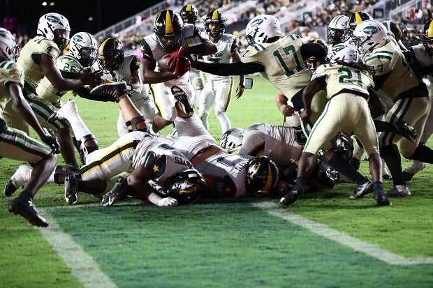 American Heritage's Byron Louis scores in the third quarter as the Patriots fought back from an 18-point halftime deficit to Miami Central, which won the 2M final 38-31. (Photo: Laura Martin)