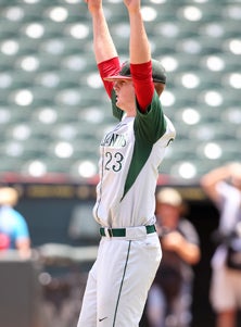 Carter Hope holds up his hands after
the final out of his team's state
5A title win over Fort Bend Dulles. 