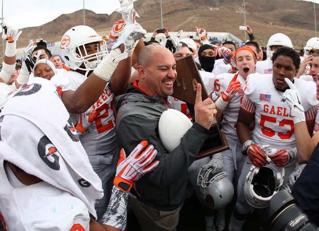 Coach Tony Sanchez celebrates with his Bishop Gorman players after winning the Nevada Division I state championship game last Saturday in Reno. Sanchez was introduced as the new UNLV head football coach Thursday.