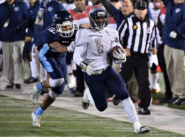 Erick Buchanan breaks a tackle and scoots down the sideline.