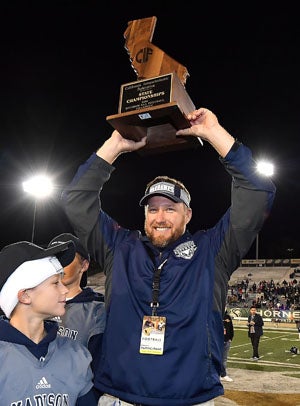 Madison coach Rick Jackson celebrates.