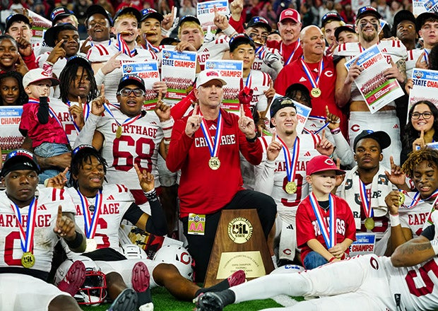 With Friday's state championship victory, Carthage head coach Scott Surratt (center) improved his career record to 249-31. (PHOTO: Alex Garza)