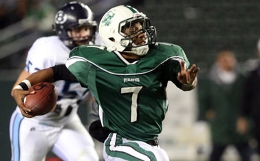 Oceanside QB Quentin Clark escapes.