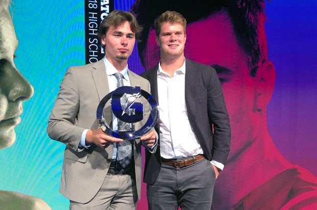 Passing the torch from one USC quarterback to another: JT Daniels (left) poses with presenter Sam Darnold. 