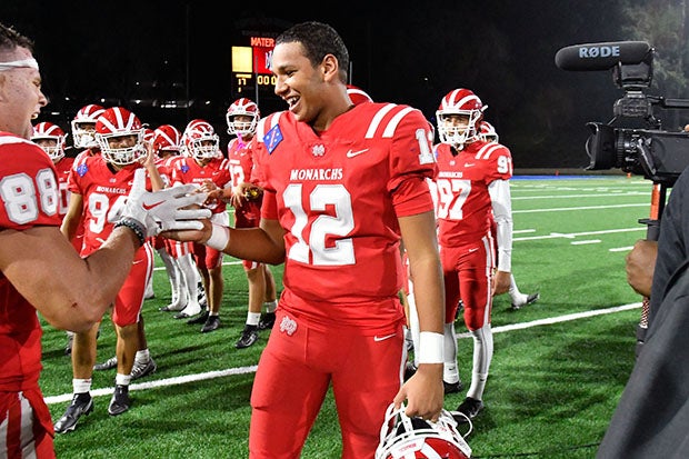 Elijah Brown celebrates with teammates after leading Mater Dei to its 24th consecutive victory Friday night over then-No. 1 St. John Bosco. (Photo: Paul Rodriguez)