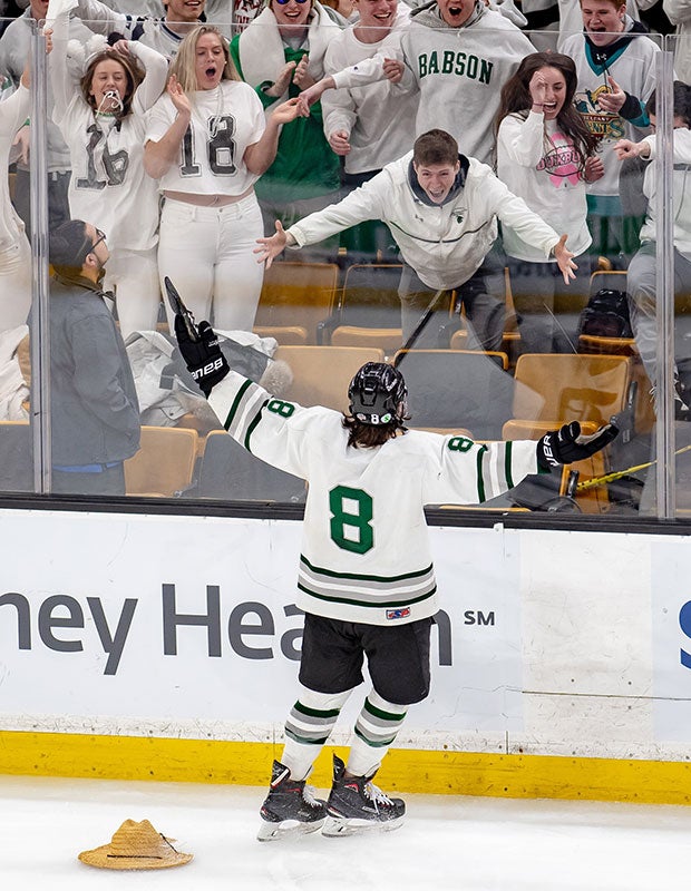 Friend Weller of Duxbury (Mass.) celebrates his hat-trick with fans during his team's victory over Winchester in the MIAA Division 1 state championship game.