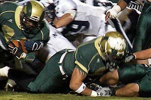 Ean Pemberton reaching for extra yardage.