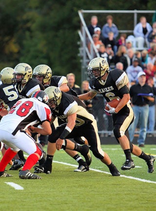 Eric Record (6) scored three TDs in Grove City's 91-12 win.