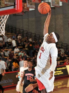 James Douglas goes up for two 
of his game-high 27 points on
an emphatic first-half dunk.