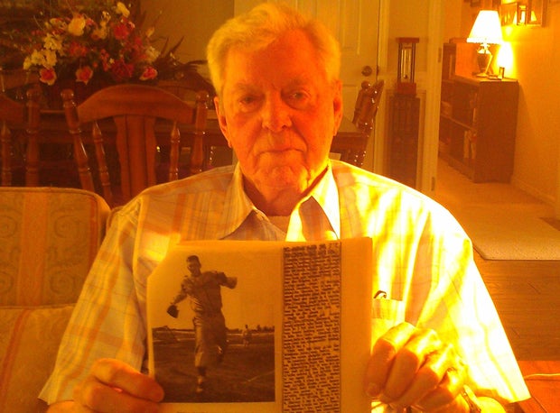 Eddie Gordon holds up the newspaper clipping that verified his state record. The Alabama man waited 61 years to get credit for the mark.
