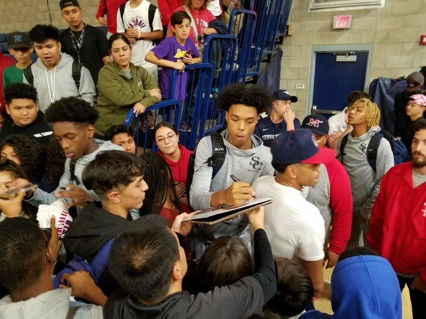 Future Kentucky Wildcat B.J. Boston signs autographs after pumping in a game-high 22 points.