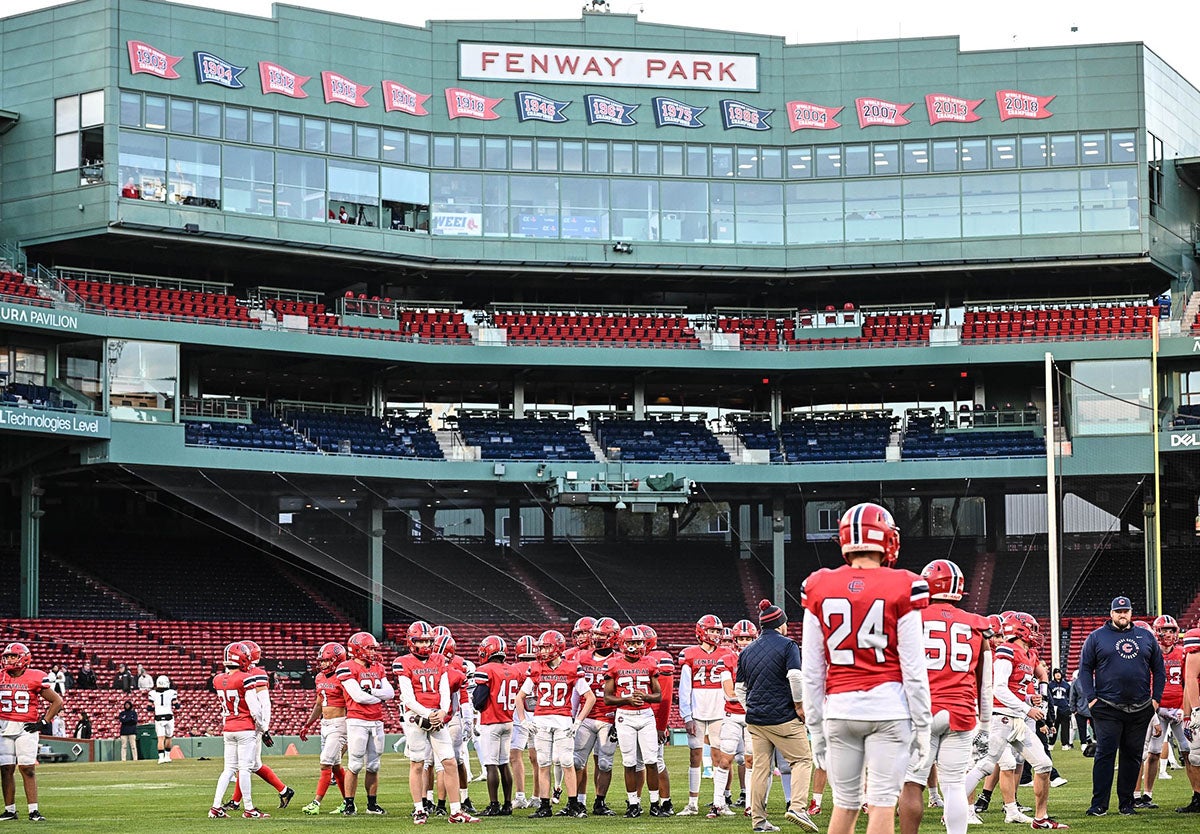 Central Catholic warms up at Fenway park prior to its game against Lawrence. (Photo: Mike Braca)
