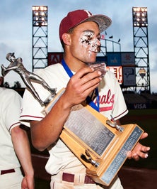 Lowell senior Elijah Saunders didn't
let three cupcakes smashed by
teammates to his face deter the sweet
celebration of his team's title win.