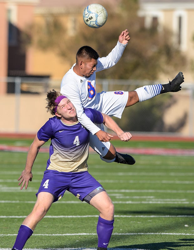 A Westwood (Ariz.) player (top) collides with Jordan Stengel of Norte Dame Prep while battling for the ball during the Coyote Classic Tournament.